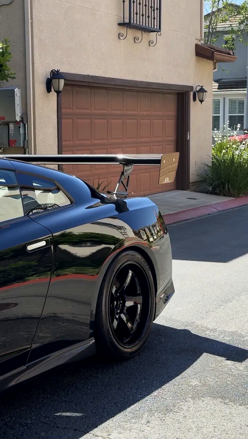 Nissan GTR rear quarter panel with glossy paint reflection