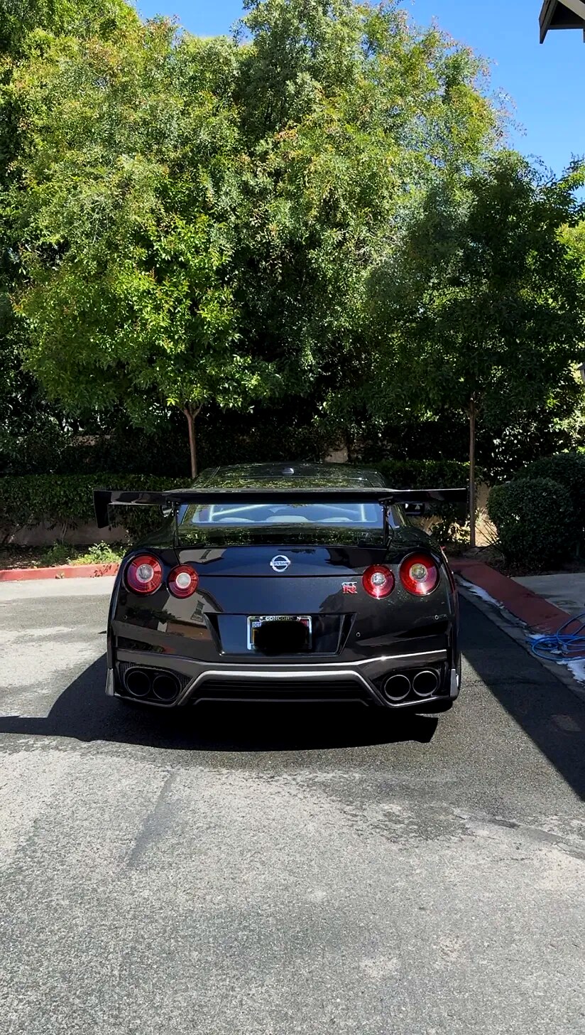 Nissan GTR rear showing quad exhaust tips and wing